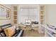 Office with built in desk and shelves, and neutral carpeted floors at 7249 Orchid Island Pl, Bradenton, FL 34202