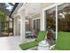 Relaxing outdoor patio with covered seating area and view of lush landscaping, perfect for entertaining or enjoying a quiet evening at 7249 Orchid Island Pl, Bradenton, FL 34202