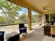 Relaxing screened porch overlooking a tranquil backyard at 2930 Oceanside St, North Port, FL 34286