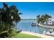 Stunning view of the waterway with palm trees and boats at 3544 San Remo Ter, Sarasota, FL 34239