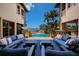 Relaxing patio with multiple seating areas and stunning water views at 3544 San Remo Ter, Sarasota, FL 34239