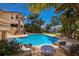 Inviting pool area with lounge chairs and lush tropical landscaping at 3544 San Remo Ter, Sarasota, FL 34239