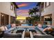 Relaxing patio with seating area overlooking the pool and water at 3544 San Remo Ter, Sarasota, FL 34239