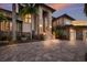 Elegant home exterior with stone accents and landscaping at 3544 San Remo Ter, Sarasota, FL 34239