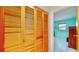 Spacious bedroom closet with light wood louvered doors at 1415 Piedmont Rd, Venice, FL 34293