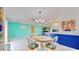 Inviting dining area featuring a charming table set, bright walls, and an open concept layout at 1415 Piedmont Rd, Venice, FL 34293