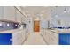 Bright kitchen with white cabinets, subway tile backsplash, and modern appliances at 1415 Piedmont Rd, Venice, FL 34293