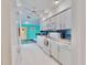 Bright kitchen with white cabinets and stainless steel appliances at 1415 Piedmont Rd, Venice, FL 34293