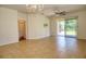 Living room with access to a screened-in patio at 13458 Abercrombie Dr, Englewood, FL 34223