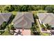Aerial view of a house with a two-car garage and a spacious backyard at 13458 Abercrombie Dr, Englewood, FL 34223