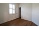 Bright bedroom with wood flooring, closet, and window with shutters at 13458 Abercrombie Dr, Englewood, FL 34223