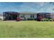 View of the backyard with two screened patios at 13458 Abercrombie Dr, Englewood, FL 34223