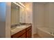 Bathroom with granite vanity, a bathtub, and a separate shower at 13458 Abercrombie Dr, Englewood, FL 34223