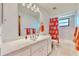 Bathroom with tub, vanity, and coral-themed accents at 1415 Piedmont Rd, Venice, FL 34293