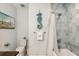 Bright bathroom with a tub/shower combo and stylish seahorse decor at 149 Mckinley Dr, Sarasota, FL 34236