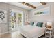 Comfortable bedroom with balcony access and a serene view of the outdoors at 149 Mckinley Dr, Sarasota, FL 34236