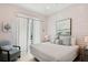Comfortable bedroom with wainscoting, soft lighting, and a decorative beach-themed aesthetic at 149 Mckinley Dr, Sarasota, FL 34236