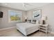 Inviting bedroom with a ceiling fan, beach-themed art, and ample natural light at 149 Mckinley Dr, Sarasota, FL 34236