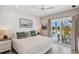 Charming bedroom with a private balcony and coastal decor at 149 Mckinley Dr, Sarasota, FL 34236