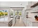Kitchen with a bright eat-in area, featuring an oversized island, modern appliances and a large island sink at 149 Mckinley Dr, Sarasota, FL 34236