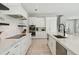 Open concept kitchen with white cabinets, stainless appliances, and a large island for cooking and entertaining at 149 Mckinley Dr, Sarasota, FL 34236