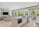 Open kitchen featuring an island with bar seating, views into the living and dining spaces, plus backyard views at 149 Mckinley Dr, Sarasota, FL 34236