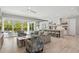 Spacious open-concept living area with a combined living room, dining area and kitchen, and access to outdoor patio at 149 Mckinley Dr, Sarasota, FL 34236
