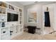 Cozy living room with a built-in entertainment center and coastal-themed decor at 149 Mckinley Dr, Sarasota, FL 34236