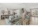 Spacious living room with modern decor, a large sofa, and easy access to the open kitchen at 149 Mckinley Dr, Sarasota, FL 34236