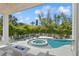 Inviting pool and spa area with fire pit and lounge chairs at 149 Mckinley Dr, Sarasota, FL 34236