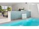 Private pool with adjacent outdoor kitchen and water feature at 1542 4Th St # 212, Sarasota, FL 34236