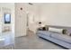 Living room with gray sofa and adjacent bathroom access at 1542 4Th St # 212, Sarasota, FL 34236