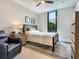 Cozy bedroom with a double bed, nightstand, and ceiling fan at 1542 4Th St # 212, Sarasota, FL 34236