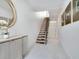 Bright entryway with modern staircase and stylish decor at 1542 4Th St # 212, Sarasota, FL 34236