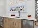 Wet bar with quartz countertop and wine chiller at 1542 4Th St # 212, Sarasota, FL 34236