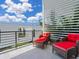 Relaxing balcony with seating, offering views of the cityscape at 1542 4Th St # 212, Sarasota, FL 34236