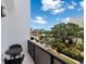 Private balcony with city views and small table and chairs at 1542 4Th St # 212, Sarasota, FL 34236