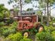 Nancy's BBQ with outdoor seating and antique tractor at 1542 4Th St # 212, Sarasota, FL 34236