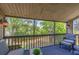 Relaxing screened porch with patio furniture, offering a view of lush landscaping at 207 Woodland Dr # 207, Osprey, FL 34229