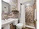 Bathroom with tiled shower and modern fixtures at 207 Woodland Dr # 207, Osprey, FL 34229