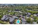 Aerial view of PineRun community, pool, and landscaping at 207 Woodland Dr # 207, Osprey, FL 34229