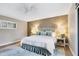 Bright bedroom with a king-size bed and calming decor at 207 Woodland Dr # 207, Osprey, FL 34229