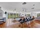 Large community room with tables, chairs, and scenic views at 207 Woodland Dr # 207, Osprey, FL 34229