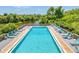 Relaxing community pool with water views and lounge chairs at 207 Woodland Dr # 207, Osprey, FL 34229