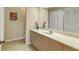 Clean bathroom with a large vanity and tiled floor at 7738 Calle Facil, Sarasota, FL 34238