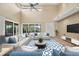 Open living area with hardwood floors, and access to backyard patio at 7738 Calle Facil, Sarasota, FL 34238