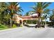 Gated entrance to the community with palm trees at 4440 Calle Serena, Sarasota, FL 34238