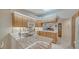 Updated kitchen with granite countertops and wood cabinetry at 4440 Calle Serena, Sarasota, FL 34238