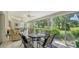 Sunroom with ample seating and stunning golf course views at 4440 Calle Serena, Sarasota, FL 34238