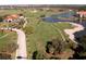 Aerial view showcasing the community's golf course and lake at 4440 Calle Serena, Sarasota, FL 34238